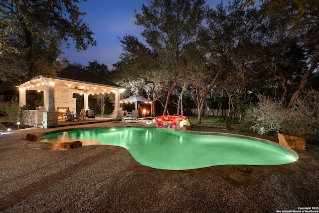 view of swimming pool featuring a gazebo