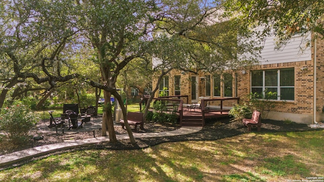 view of yard featuring a deck