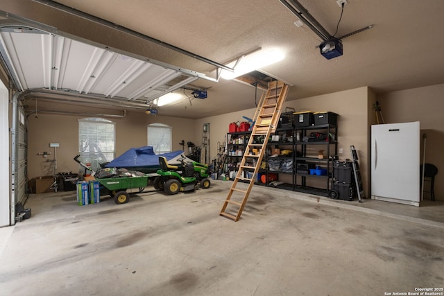 garage with white refrigerator and a garage door opener