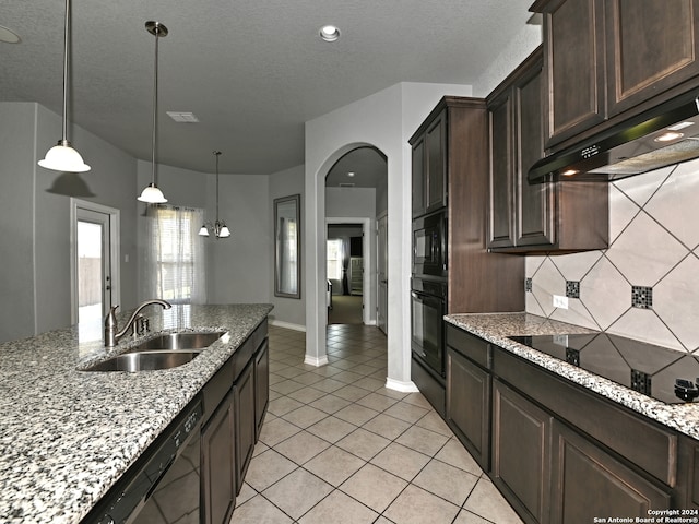 kitchen with black appliances, sink, dark brown cabinets, light stone counters, and extractor fan