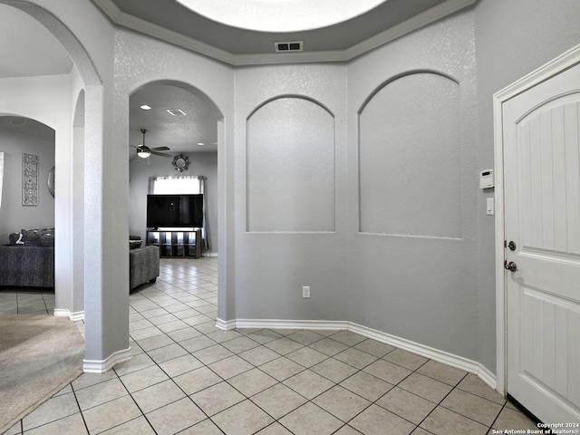 tiled foyer entrance with ceiling fan