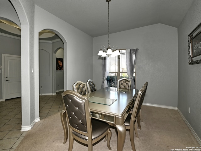 tiled dining room featuring crown molding and an inviting chandelier