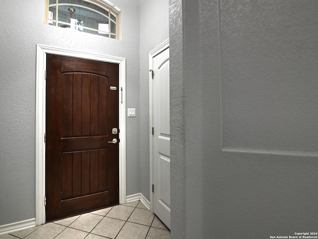 entryway featuring light tile patterned flooring