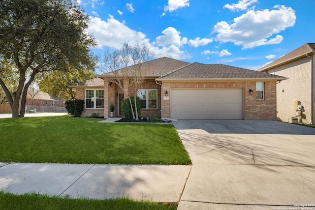 view of front of house featuring a garage and a front yard