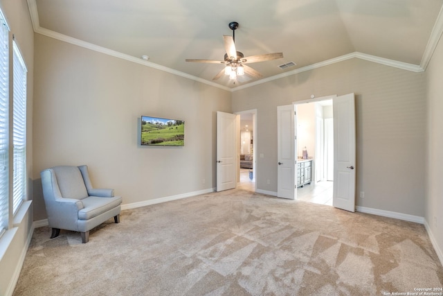 unfurnished room with ornamental molding, light colored carpet, ceiling fan, and lofted ceiling