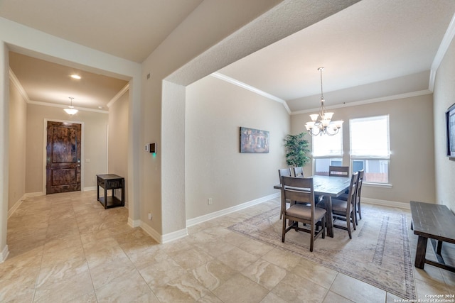 dining area featuring ornamental molding and an inviting chandelier