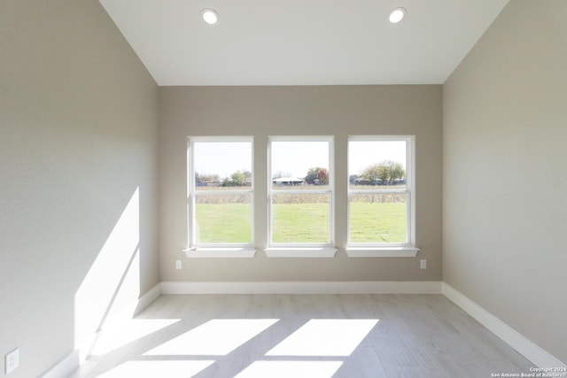 unfurnished room featuring light hardwood / wood-style flooring