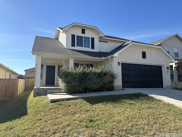 view of front of home featuring a garage and a front yard