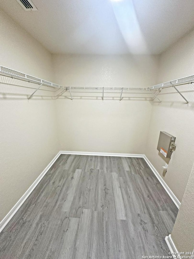 spacious closet featuring hardwood / wood-style floors