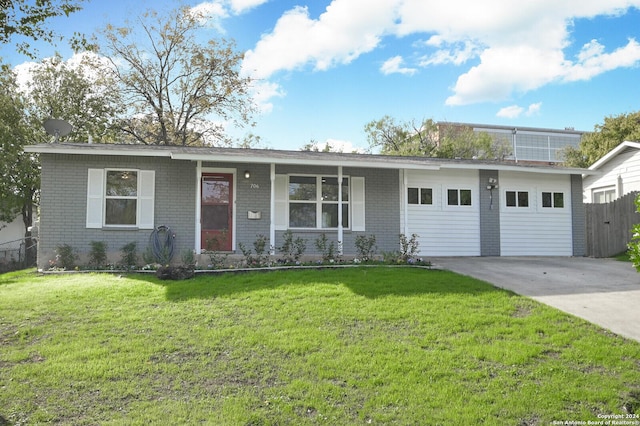 single story home with a garage and a front yard