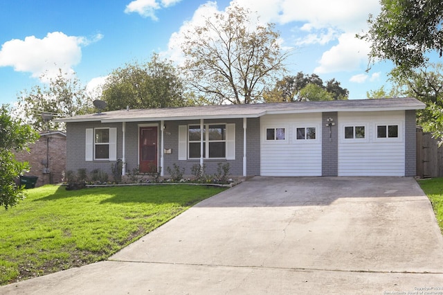 ranch-style house featuring a garage and a front lawn