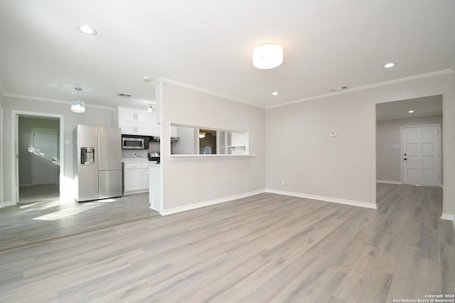 unfurnished living room with light hardwood / wood-style flooring and ornamental molding