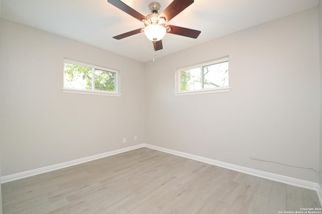 unfurnished room featuring light hardwood / wood-style flooring and ceiling fan