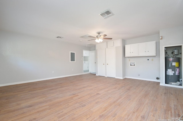 unfurnished living room featuring ceiling fan, light hardwood / wood-style floors, and electric water heater