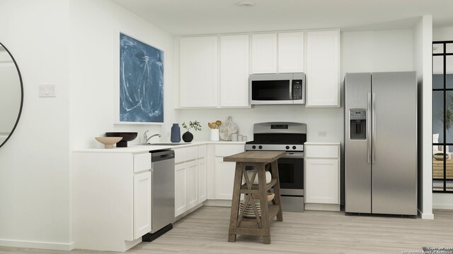 kitchen featuring white cabinetry, sink, appliances with stainless steel finishes, and light hardwood / wood-style flooring