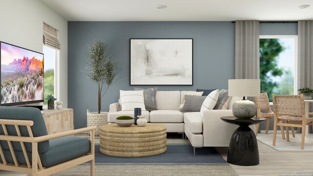 living room featuring a wealth of natural light and hardwood / wood-style floors