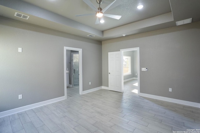 unfurnished room featuring ceiling fan and light hardwood / wood-style floors