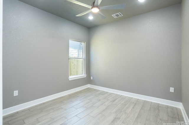 unfurnished room with ceiling fan and light wood-type flooring