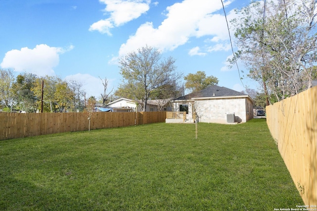 view of yard with central air condition unit