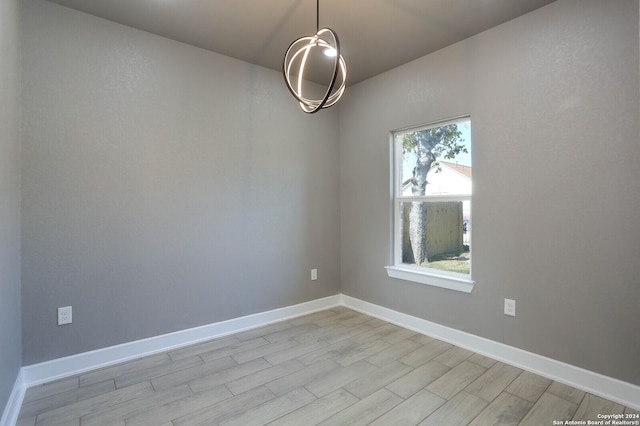 spare room with light hardwood / wood-style floors