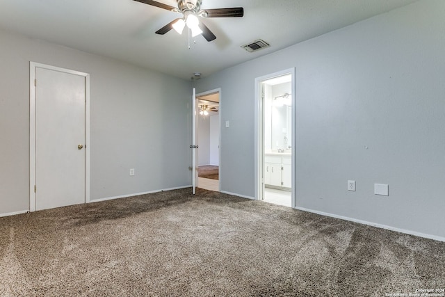 unfurnished bedroom featuring carpet, connected bathroom, and ceiling fan