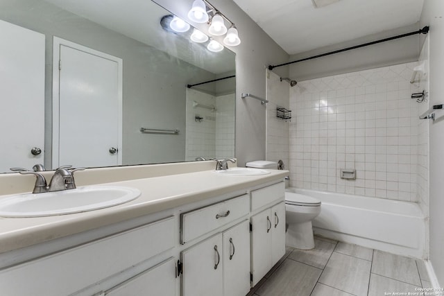 full bathroom with tile patterned flooring, vanity, toilet, and tiled shower / bath combo