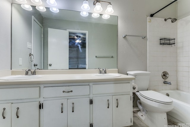 full bathroom with vanity, toilet, and tiled shower / bath