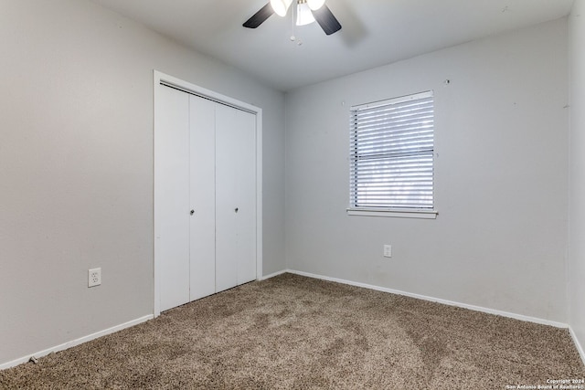 unfurnished bedroom with carpet flooring, a closet, and ceiling fan