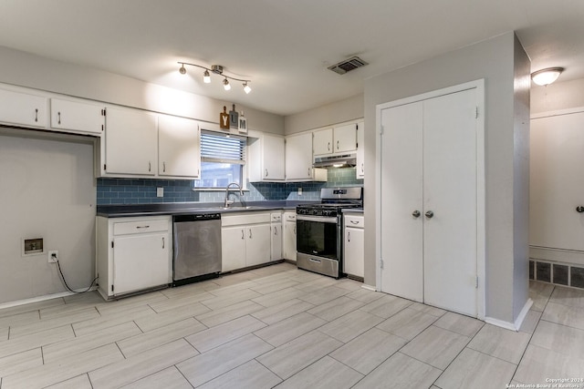 kitchen featuring decorative backsplash, appliances with stainless steel finishes, white cabinetry, and sink