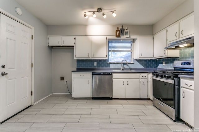 kitchen with tasteful backsplash, white cabinetry, sink, and appliances with stainless steel finishes