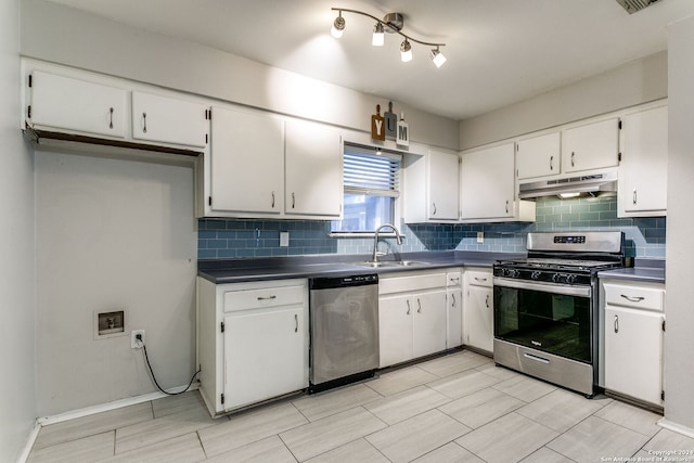 kitchen with backsplash, sink, white cabinetry, and stainless steel appliances