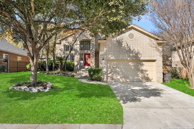 view of front of home with a garage and a front lawn