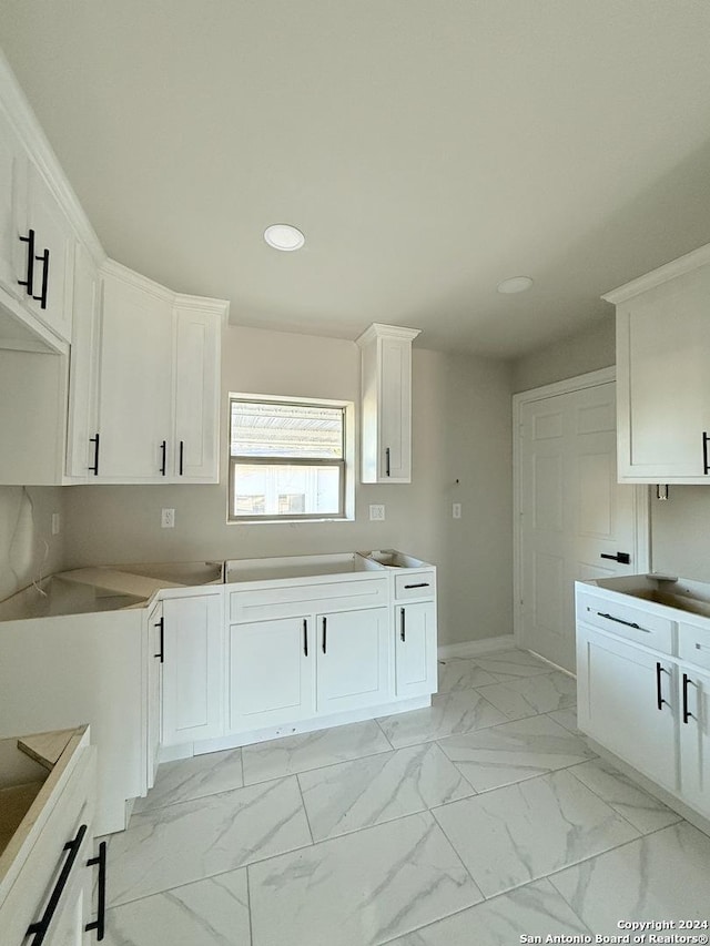 kitchen with white cabinets