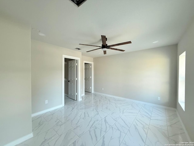 spare room with ceiling fan