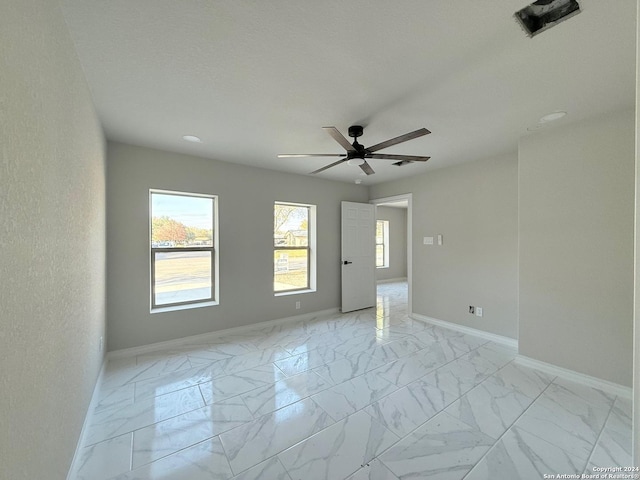 spare room featuring ceiling fan