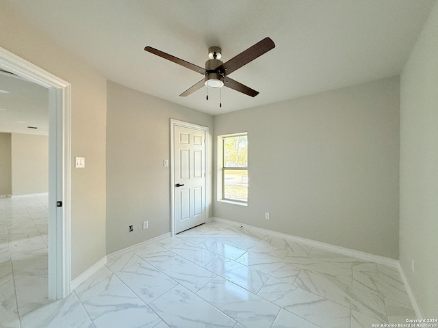 empty room featuring ceiling fan