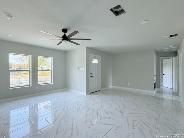 empty room featuring ceiling fan