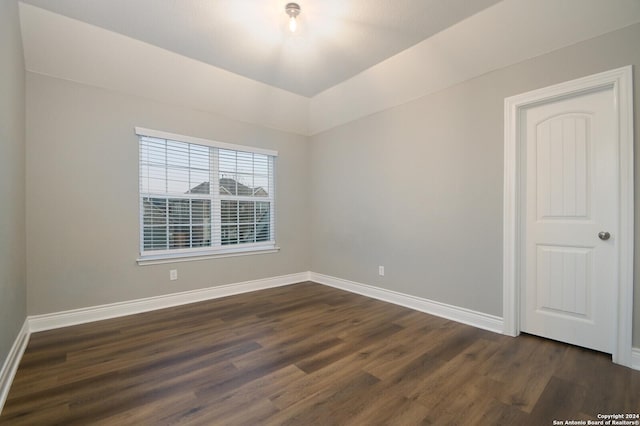 spare room featuring dark hardwood / wood-style flooring