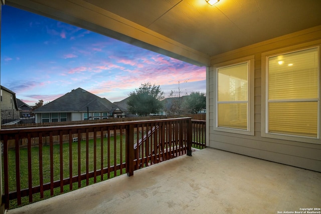 view of balcony at dusk