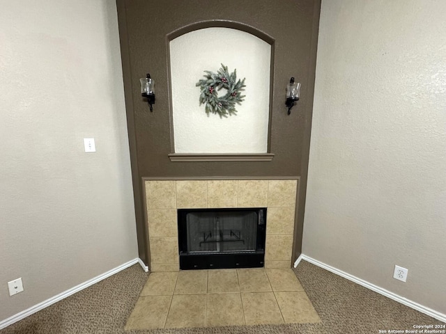 interior details with carpet flooring and a fireplace