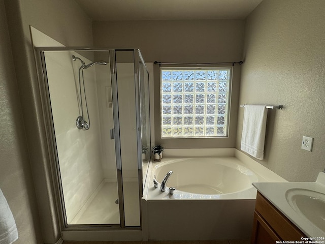 bathroom with vanity and plus walk in shower