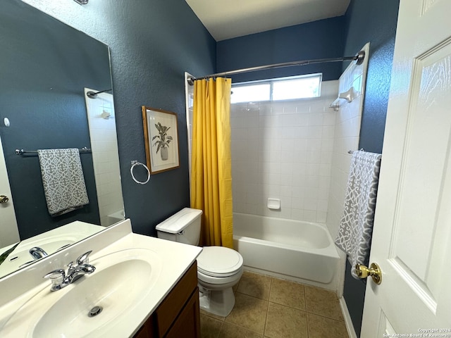 full bathroom featuring tile patterned flooring, shower / bath combo, toilet, and vanity