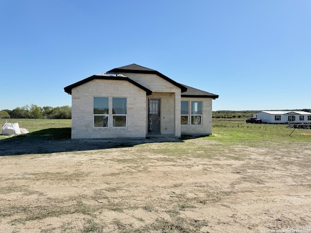 view of front of home with a front yard