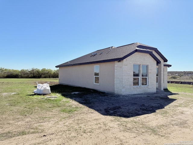 view of home's exterior featuring a lawn