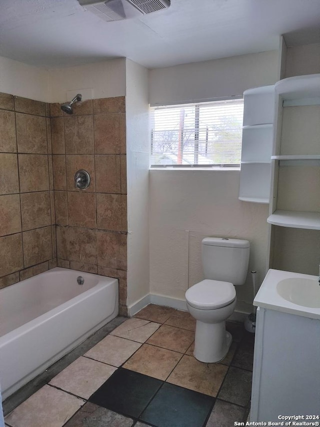 full bathroom featuring vanity, toilet, and tiled shower / bath