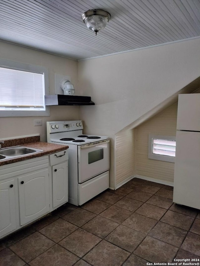 kitchen with white cabinetry, sink, and white appliances