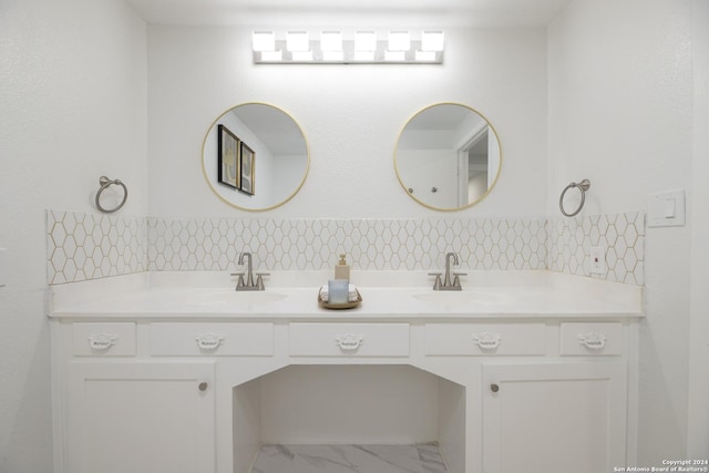 bathroom featuring vanity and backsplash