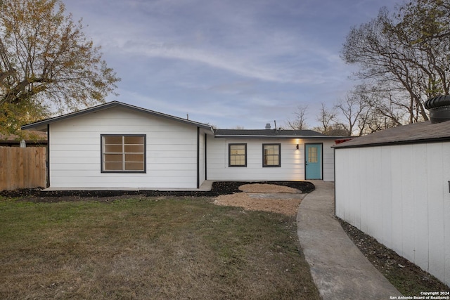 ranch-style house with a front lawn