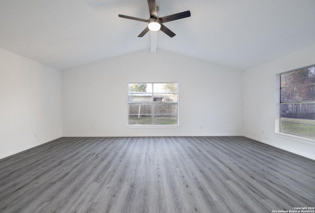 empty room with lofted ceiling with beams, ceiling fan, and light hardwood / wood-style floors