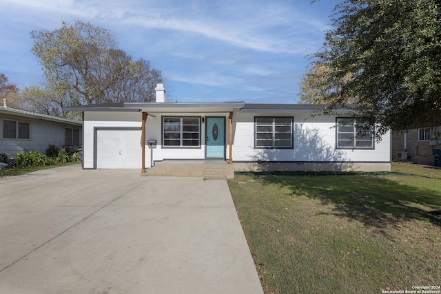 ranch-style home featuring a garage and a front yard